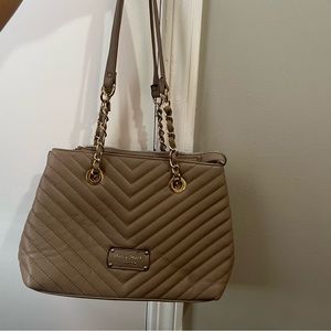 Beige shoulder bag with gold strap detailing
